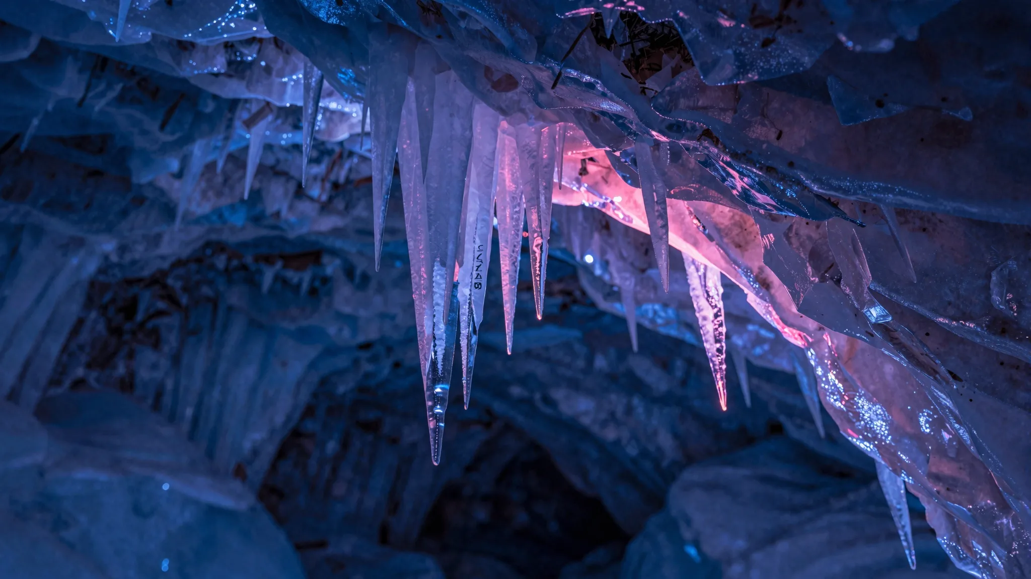 Ice cave ceiling with hanging blue formations