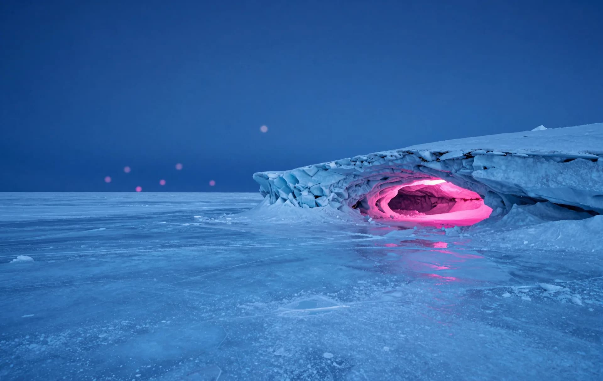 Looking from inside an ice cave toward a bright exterior