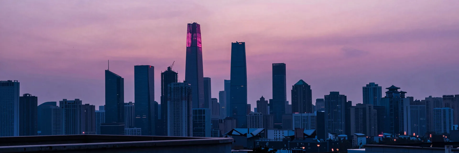 Ultra-wide distant skyline of overgrown skyscrapers receding under a vast sky.