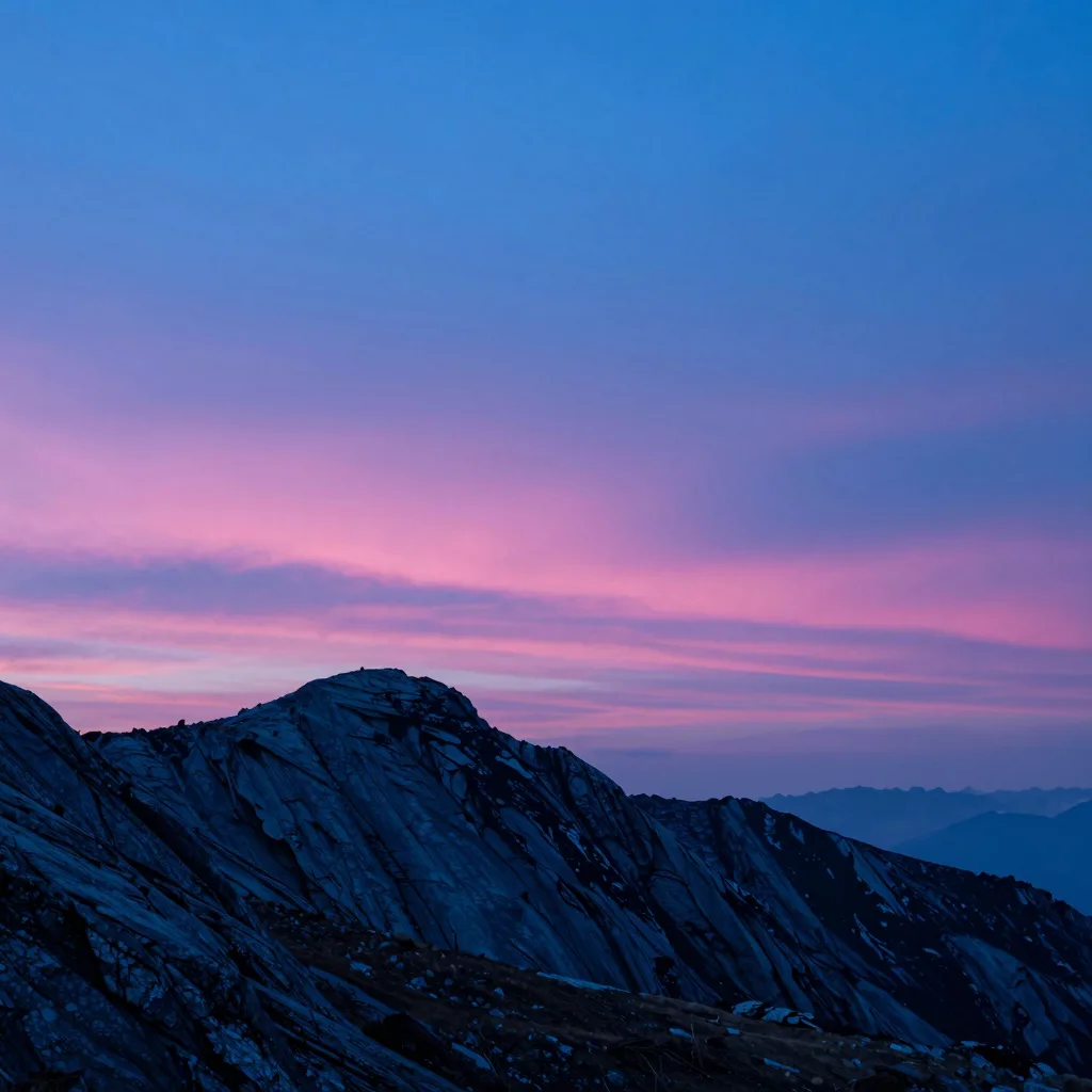 atmospheric wide of alpine ridge form under electric-blue sky with hot-pink sunset accent - companion image for the Meta attribution audit 31-percent essay