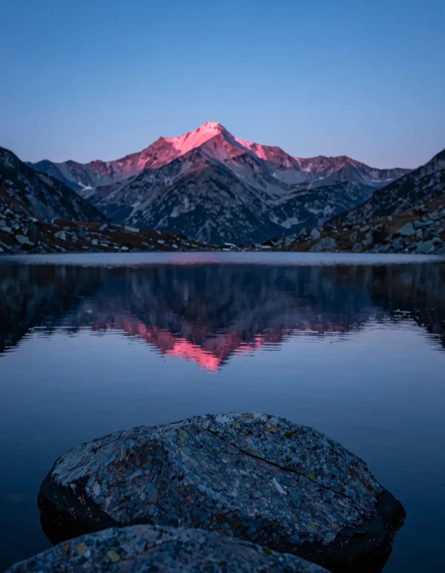 portrait orientation of alpine ridge form under electric-blue sky with hot-pink sunset accent - companion image for the ROAS is the wrong north-star metric essay