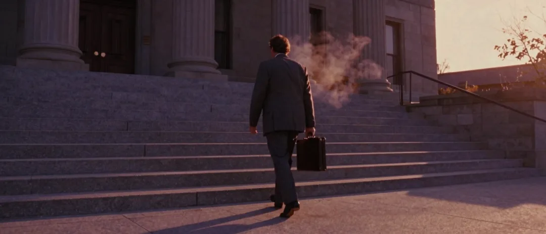 An attorney walking past the county courthouse on a fall afternoon, 1995.