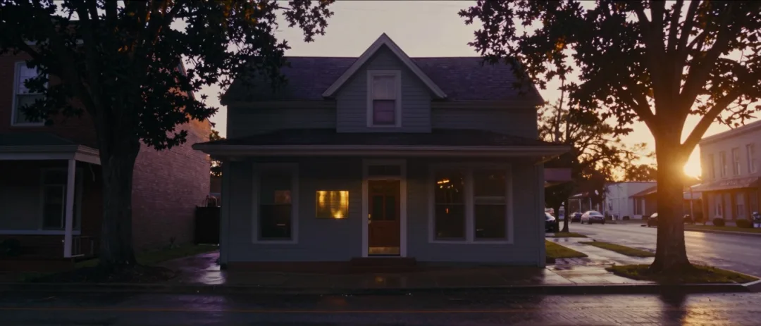 Small-town North Carolina main street at dawn, a brass office plate catching the first light.